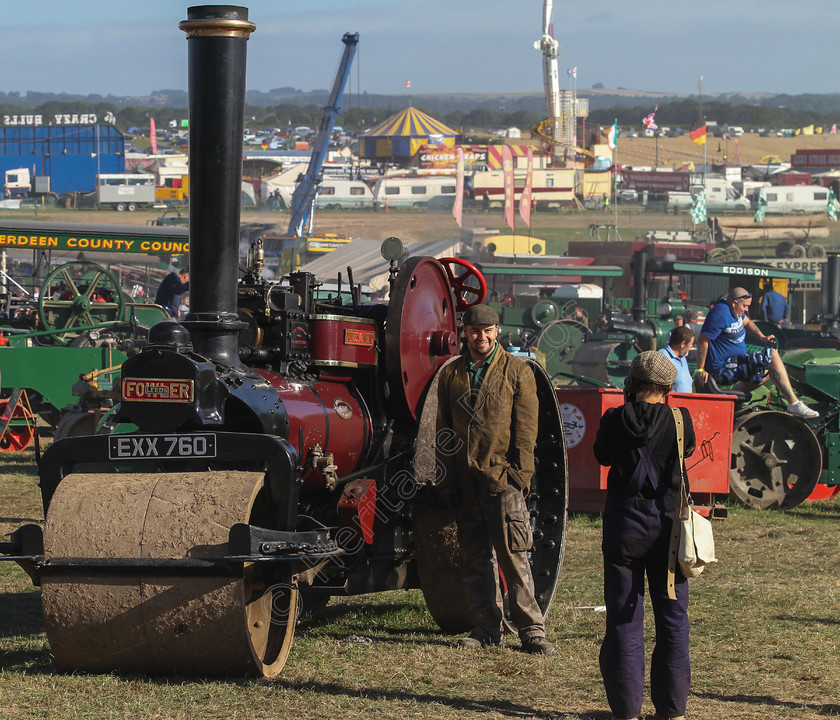 IMG 2916 
 The Great Dorset Steam Fair 2013. Posing for photos. 
 Keywords: Great Dorset Steam Fair 2013 GDSF Traction Engine Heritage Photography Photo Photos British Tarrant Hinton Road Roller Chimney Boiler Flywheel Red People