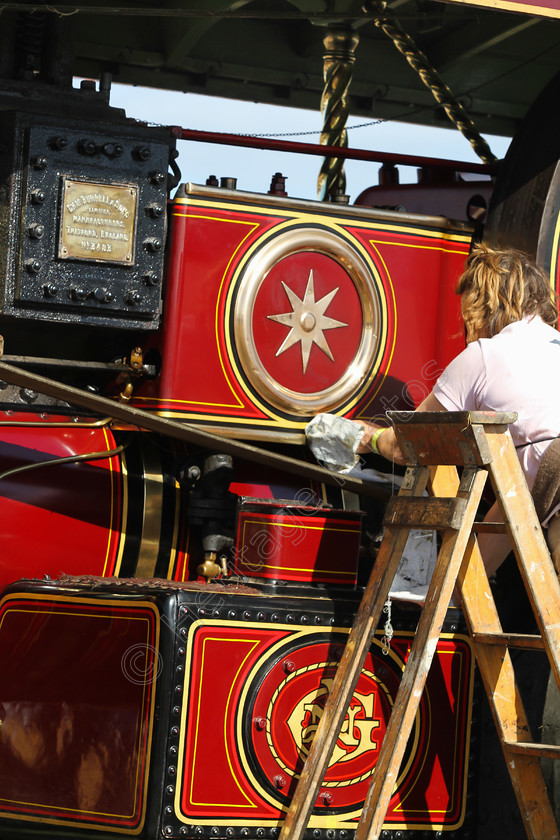 IMG 2993 
 The Great Dorset Steam Fair 2013. Cleaning Showmans Engine. 
 Keywords: Great Dorset Steam Fair 2013 GDSF Traction Engine Heritage Photography Photo Photos British Tarrant Hinton Cleaning Showmans Engine Lady Ladder Red Clean Brass
