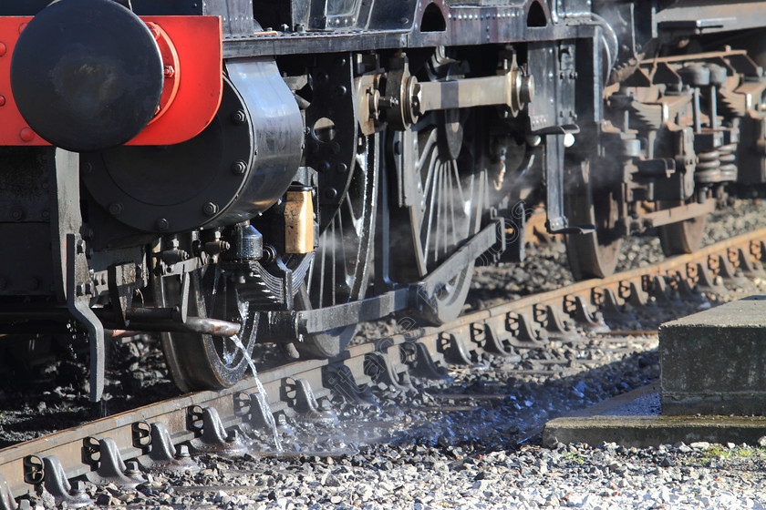 IMG 8936C 
 Steam train wheel, water overflow detail. 
 Keywords: Steam Train Wheel Steam Track Buffer