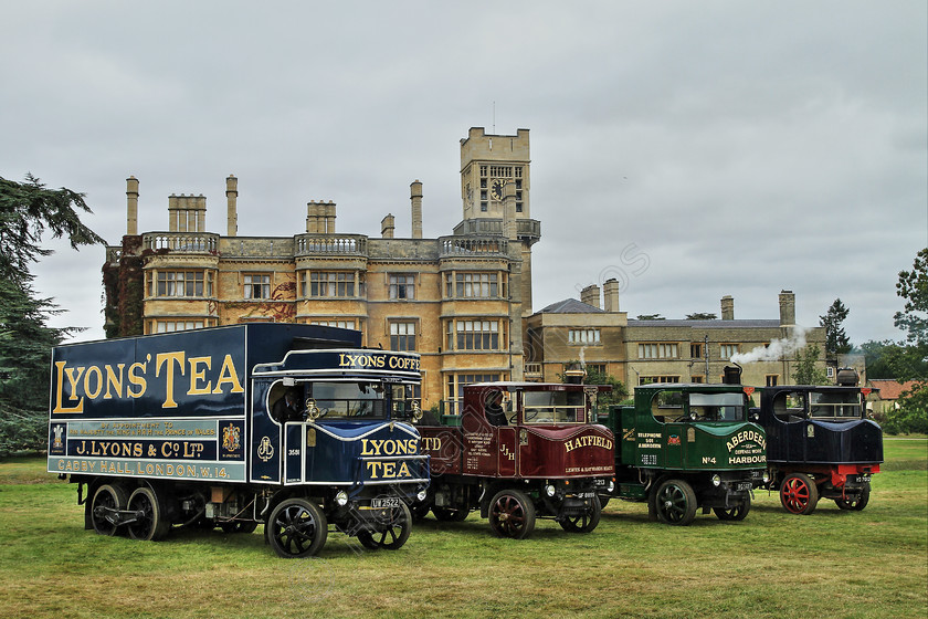 IMG 1081CHDR 
 Line of Sentinel Steam Wagons in front of the 'Old Warden' in Bedfordshire. HDR. 
 Keywords: Line of Sentinel Steam Wagons In Front Old Warden Bedfordshire HDR High Dynamic Range Photo Photography Smoke Boiler Transport Waggon Lorry Blue Maroon Green Goods Vehicle British