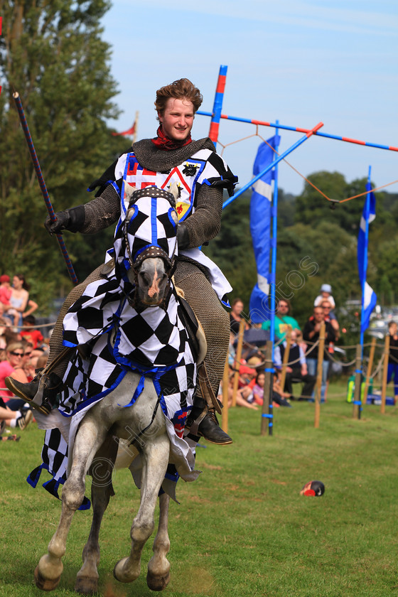 IMG 9031 
 'The Knights Of Royal England', Knight on horse at Hever Castle 2012. 
 Keywords: Knights Royal England Hever Castle Jousting Mediaeval Lance Horse Knight Helmet Armour Flag Flags Banner Black White Cheque Riding Chainmail Suit