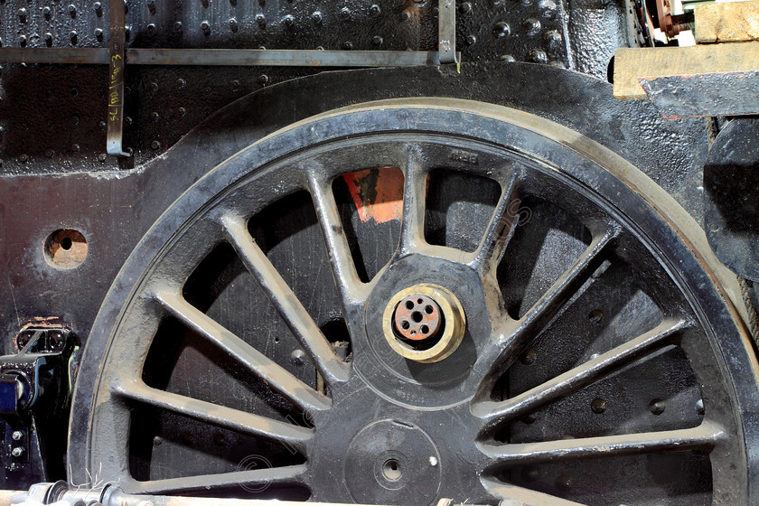 IMG 0043C 
 Steam Train wheel under going restoration. 
 Keywords: Steam Train Wheel Repair Spokes Restore Restoration Grease Oil