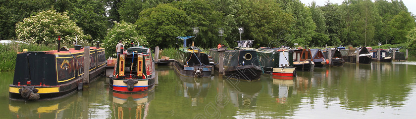 IMG 4053C 
 Narrow boats moored in a line. 
 Keywords: Line Narrow Boats Canal Canals Water River Living Home Chimney Live