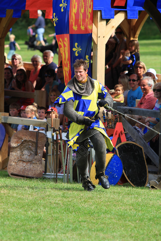 IMG 8970 
 'The Knights Of Royal England', fighting at Hever Castle 2012. 
 Keywords: Knights Royal England Hever Castle Jousting Mediaeval Lance Horse Knight Helmet Armour Flag Flags Banner Blue Yellow Audience Crowd Banner Chainmail Suit
