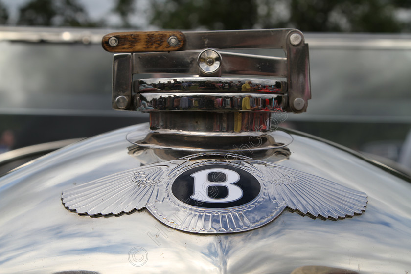 IMG 1355 
 Bentley Vintage car badge and radiator cap detail. 
 Keywords: Bentley Vintage Car Badge Radiator Cap Detail Classic British Black Silver Reflection Wings Transport Sports