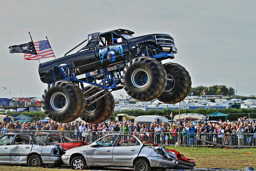 IMG 2234HDR 
 The 'Grim Reaper' monster truck, at the Great Dorset Steam Fair. HDR. 
 Keywords: The Grim Reaper Monster Truck Great Dorset Steam Fair GDSF HDR High Dynamic Range Photo Photography Cars Smash Crush Flying Crowd Large Wheels Wheel Tyre Tyres Flags Blue