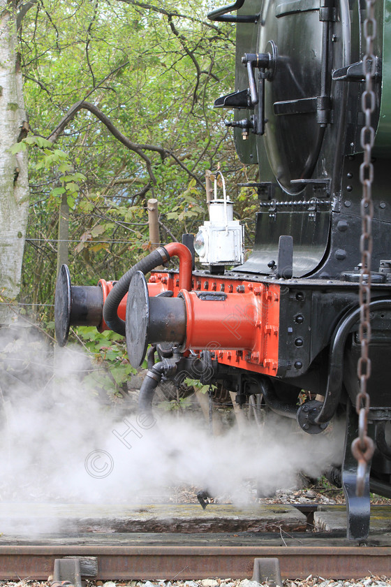 IMG 3088 
 Steam Train letting off Steam. 
 Keywords: Steam Train Letting Off Steam Buffers Black Red Boiler Coal Track Railway Lamp Chains