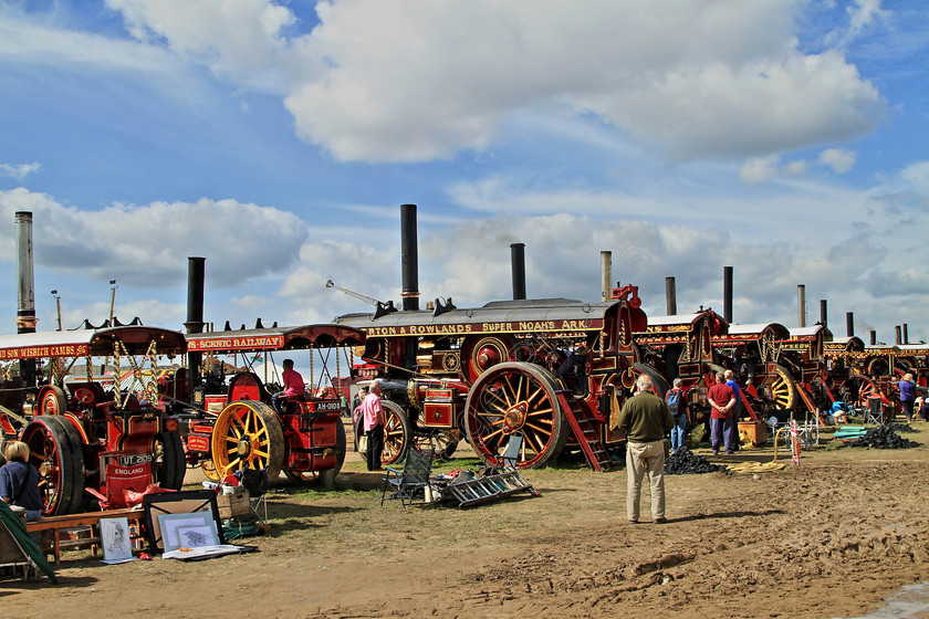 IMG 1825HDR 
 The famous Showmans Engine Lineup at the Great Dorset Steam Fair. HDR. 
 Keywords: The Famous Showmans Engine Lineup Great Dorset Steam Fair HDR High Dynamic Range Photo Photography Fair Fairground Steam Smoke Canopy Wheel Wheels Generate Power Dynamo Clouds Showman