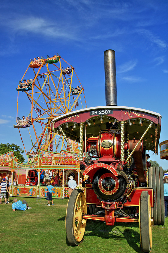IMG 0803HDR 
 Showmans engine in front of a ferris wheel. HDR. 
 Keywords: Showmans Engine In Front Ferris Wheel HDR High Dynamic Range Photo Photography Fair Fairground Chimney Wheel Wheels Transport Generate Electricity Dynamo Power Lights
