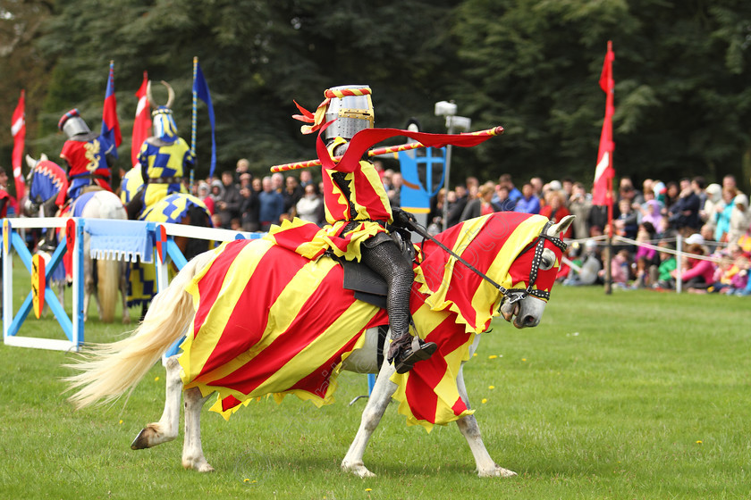 IMG 2344C 
 'The Knights Of Royal England', Jousting at Blenheim Palace 2012. 
 Keywords: Knights Royal England Blenheim Palace Jousting Mediaeval Lance Horse Knight Helmet Armour Flag Flags Banner Red Yellow Chainmail Suit