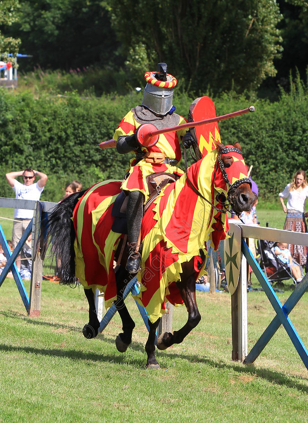 IMG 9281C 
 'The Knights Of Royal England', at Hever Castle 2012. 
 Keywords: Knights Royal England Hever Castle Jousting Mediaeval Lance Horse Knight Helmet Armour Flag Flags Banner Red Yellow Shield Gallop