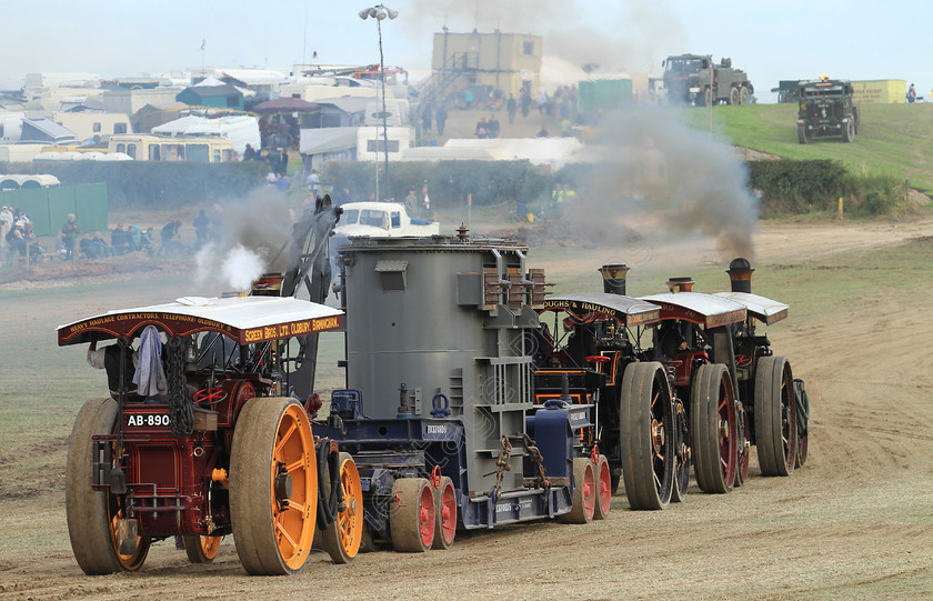 IMG 2463C 
 Four Steam Traction Engine's, haul a transformer in the Heavy Haulage Arena at the Great Dorset Steam Fair. 
 Keywords: Four Steam Traction Engines Great Dorset Steam Fair GDSF Haul Haulage Transformer Heavy Arena Chimney Chimneys Smoke Wheel Wheels Flywheel Brass Red Yellow Grey Canopy Low Loader Governor Whistle Pull Pulling Machinery