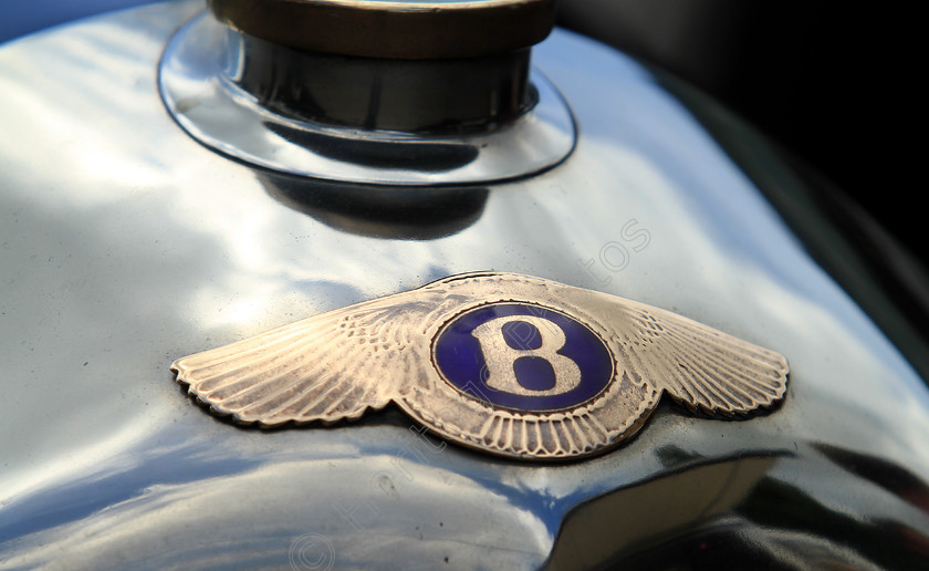 IMG 4877C 
 Bentley vintage car insignia detail. 
 Keywords: Bentley Vintage Car Insignia Detail Badge Logo Classic British Engine Reflection Transport Sports Tourer