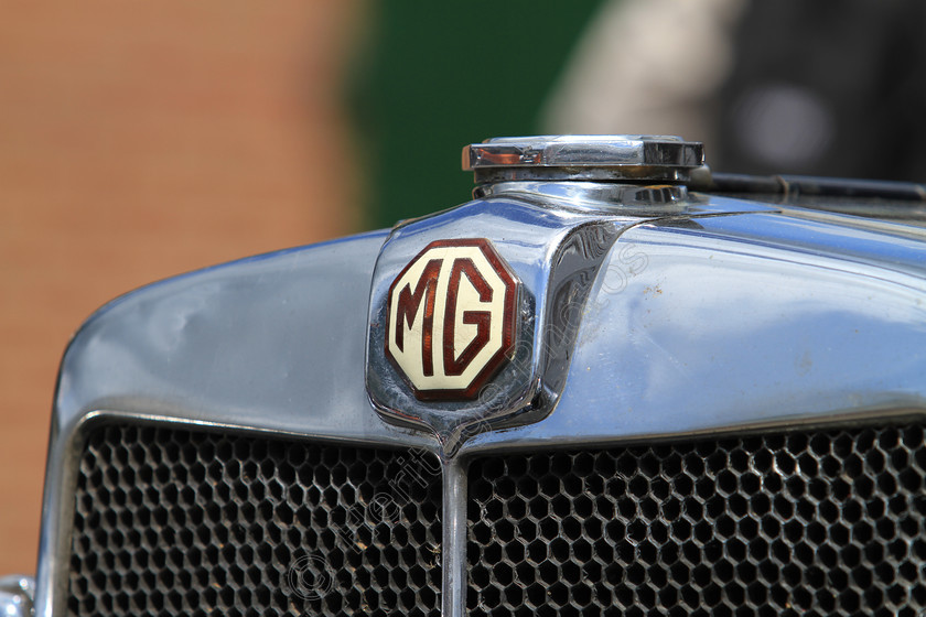 IMG 4872 
 MG vintage car insingnia detail. 
 Keywords: MG Vintage Car Insignia Badge Logo Radiator Cap Grille Classic British Transport Reflection