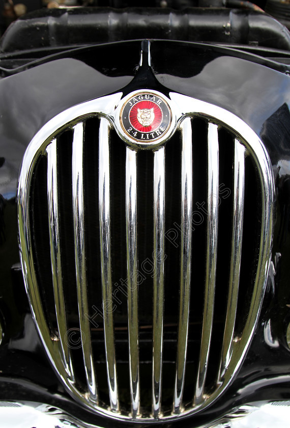 IMG 1385C 
 Jaguar MK II 2.4 Litre car badge and radiator detail. 
 Keywords: Jaguar MK II 2.4 Litre Car Badge Radiator Detail Red Black British Classic Engine Transport Vehicle Prestige Driver