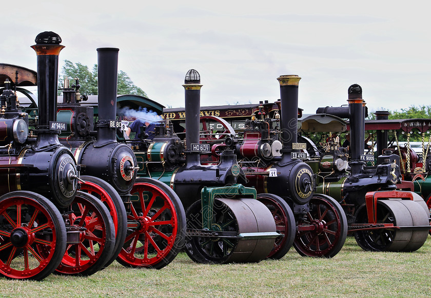 IMG 2245CHDR 
 Collection of Steam Engines and Road Rollers. HDR. 
 Keywords: Collection Steam Engines Road Rollers HDR High Dynamic Range Photo Photography Red Maroon Green Black Chimney Canopy Boiler Gathering Lineup